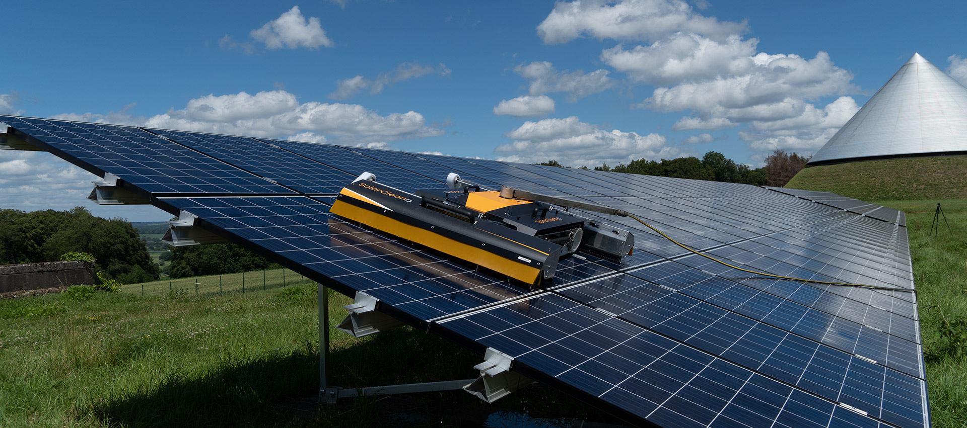 utility scale solar panel farm cleaning with robot